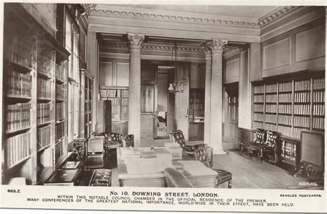 An Old Black And White Photo Of A Room With Many Bookshelves In It