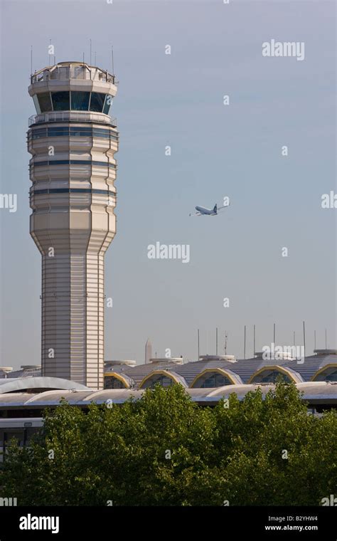 Airtraffic Control Tower As A Plane Flies By At Ronald Reagan