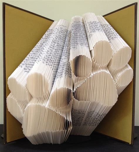 We suspect that this is quite an old idea; PAW PRINTS - Book Folding Pattern. DIY gift for book art ...