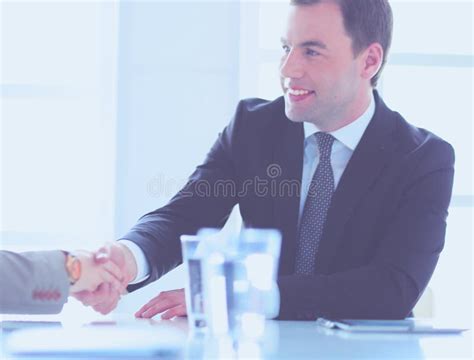 Portrait Of Young Man Sitting At His Desk In The Office Stock Image