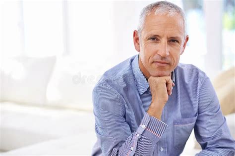 Silent Confidence Portrait Of A Thoughtful Mature Man Sitting In His