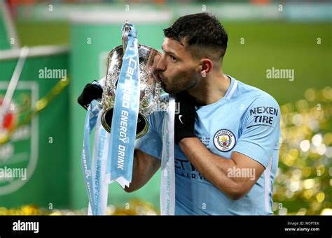 Manchester City S Sergio Aguero Kisses The Cup After The Carabao Cup Final At Wembley Stadium
