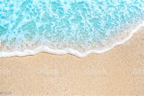 Summer Background With Soft Wave Of Blue Ocean On Sandy Beach Stock