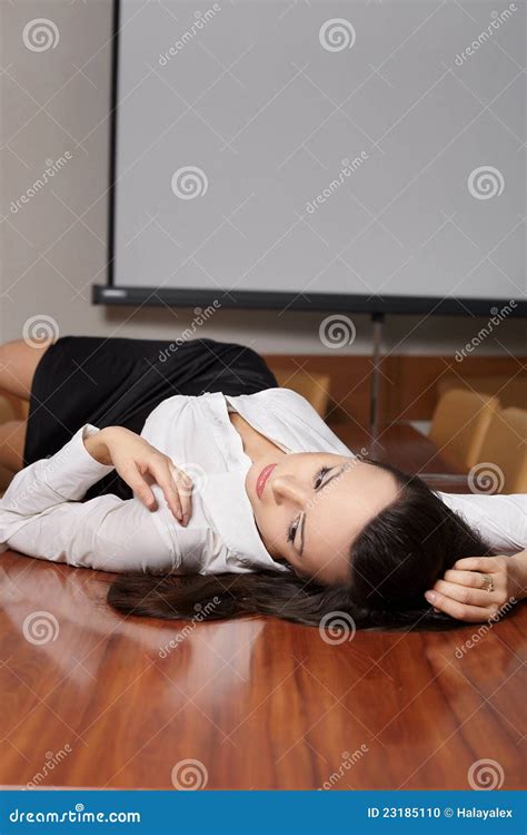 Sexy Business Woman Lying On The Desk Stock Photo Image