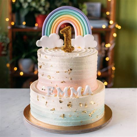 Two Tier Pastel Pink Mint And Gold With Rainbow Topper Rainbow Birthday Cake First Birthday