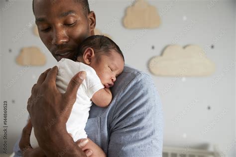 Father Holding Newborn Baby Son In Nursery Stock Photo Adobe Stock