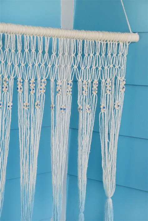So for boho decor possession you can check out this lovely crochet wall hanging with an adorable style and the cute fringes hanging at the end. Magical DIY Macrame Wall Hanging - Craft Paper Scissors
