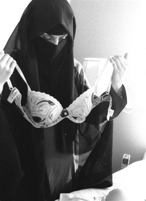 Photo Of Muslim Woman Wearing Face Veil While Holding Bra Stirs