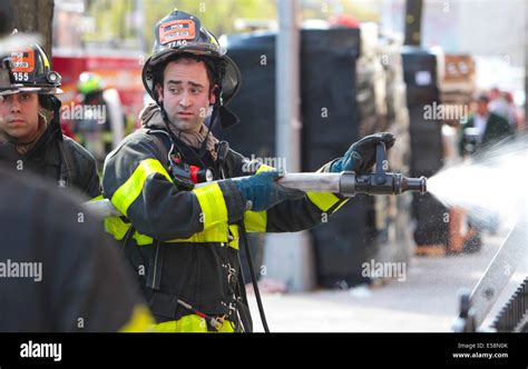New York City Fdny Firefighters Spray Water On Residential Fire In