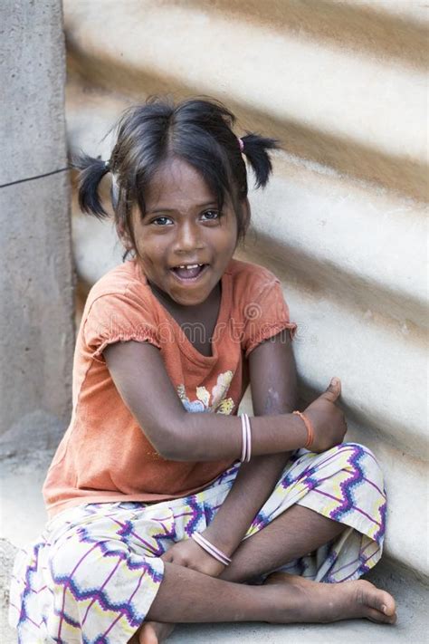 Portrait Of Unidentified Indian Poor Kid Girl Child Is Smiling Outddor