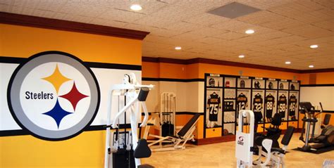 This boy's bedroom embodies the superhero theme, combining various shades of blue in drapery and storage shelving can be made to fit particular themes in their designs, making it another viable. Pittsburgh Steelers 1970's Themed Locker Room Murals by ...