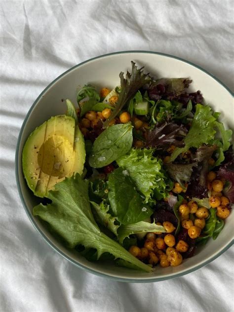 A Salad With Lettuce Chickpeas And Avocado In A Bowl