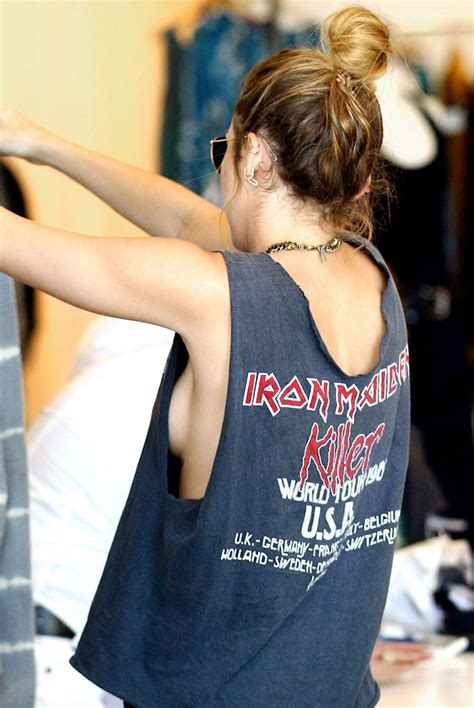 PIC Miley Cyrus Goes Braless In Iron Maiden Tank Top Style News