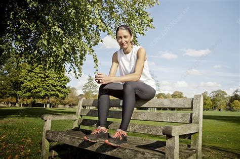 Woman Sitting On Park Bench Stock Image F Science Photo