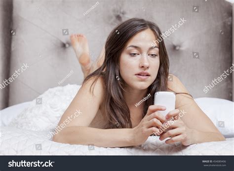 Naked Woman Lying Bed Types Message Nh C S N Shutterstock