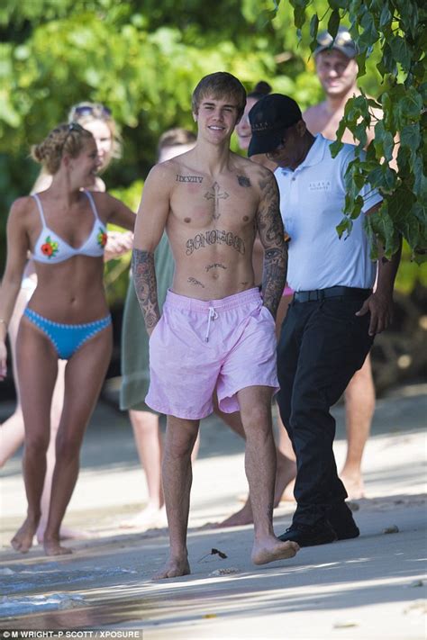 Justin Bieber Attracts Bikini Clad Fans While Hitting The Beach On His Caribbean Vacation