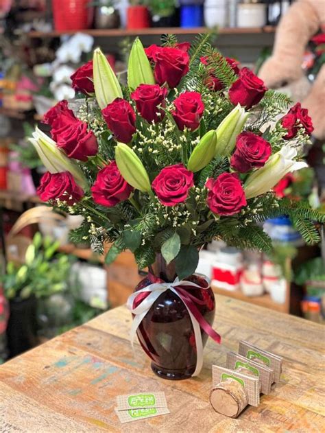 Flower Arrangement With Red Roses And Lilies In A Vase Buy In