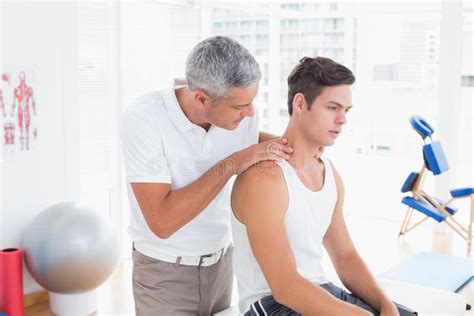 Doctor Examining His Patient Neck Stock Photo Image Of Painful