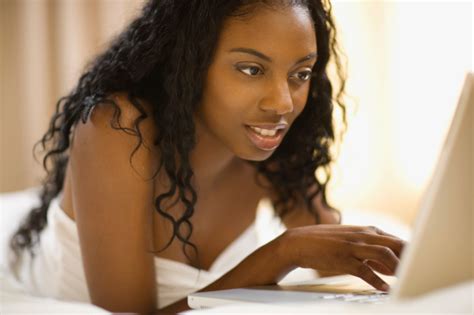 Woman On Laptop Laying Down
