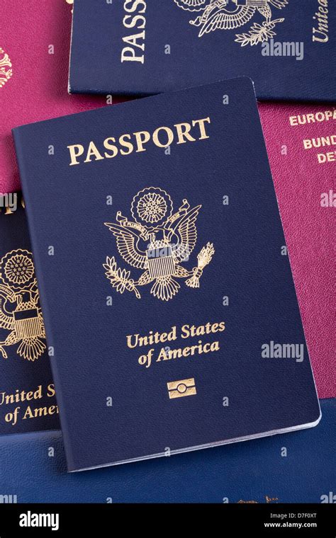 A Usa Passport Resting On Stack American German Passports This Is New Version Passport