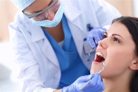 Woman Dentist Working At Her Patients Teeth The Smart Choice