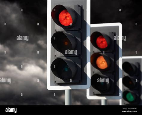 Row Of Three Road Traffic Lights Showing Red Amber Green Sequence With