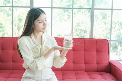 asia woman drinking water on sofa stock image image of human drinking 235230453