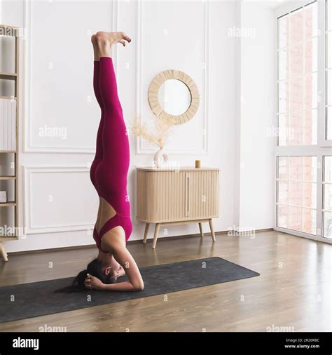 A Young Woman Leading A Healthy Lifestyle And Practicing Yoga Performs