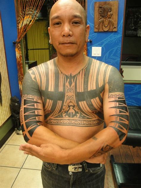 Filipino Men At The Spiritual Journey Tattoo Shop Proudly Showing Their Cultural Pride With