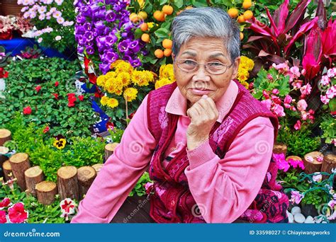 Old Lady In Front Of Flower Garden Stock Image Image Of Garden Alone
