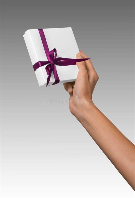 Woman Hand Holding Holiday Present White Box With Pink Ribbon Stock