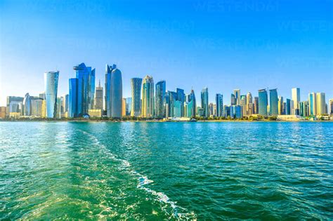 Cityscape Of Doha West Bay Skyline From Boat Trip In Doha Bay At Sunset