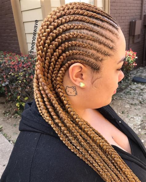 The highlight of this hair look is the singular cornrow that runs down the center of the model's head, from which shoot out all the cornrows from the sides. 4693353811 #MALE-BRAIDER #DTX on Instagram: "Fall color ...