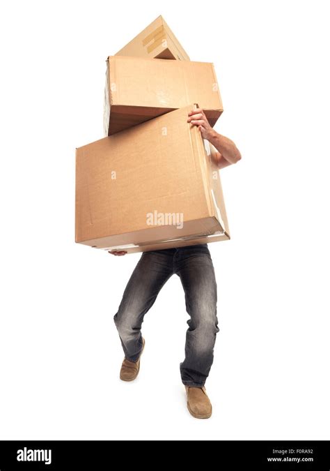 Shot Of Man Struggling To Carry Boxes While Moving House Stock Photo