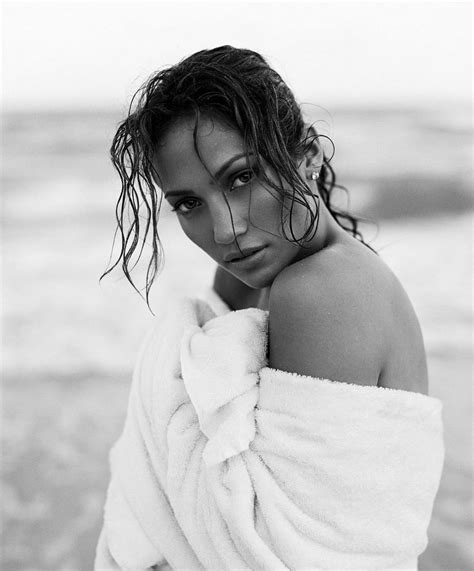 A Woman Wrapped In A Towel On The Beach