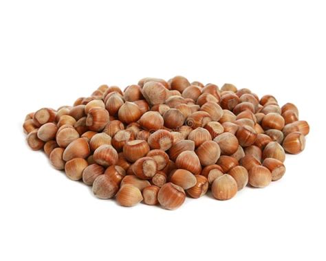 Closeup Of A Heap Of Hazelnuts Isolated On White Background Stock Photo