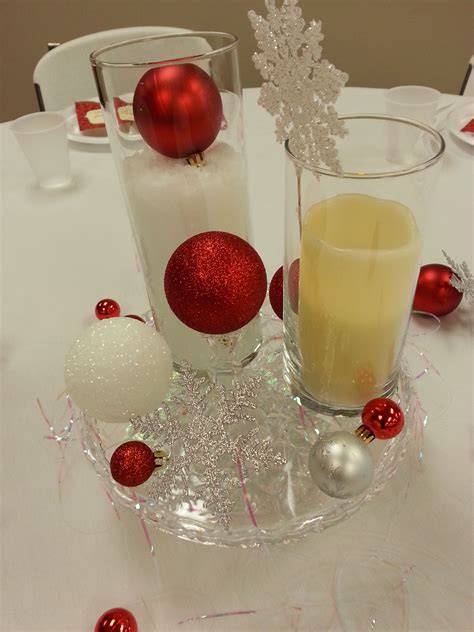 Christmas Centerpiece With Red And Silver Ornaments And Snowflakes