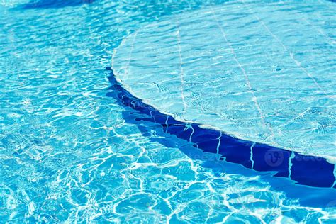 Background Of Water In Blue Swimming Pool Water Surface With A Sun