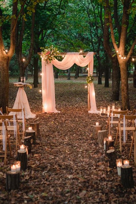 Wedding Arch In The Forest With Light Bulbs Rustic Decor Stock Photo