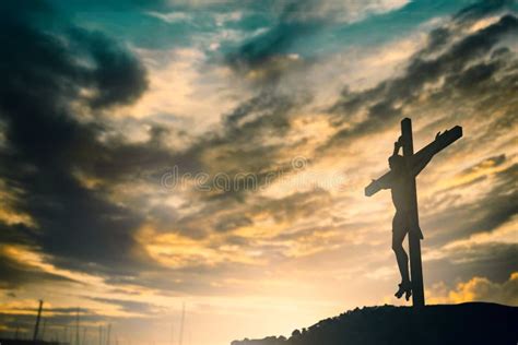 Silhouette Of Jesus With Cross Over Sunset Concept For Religion