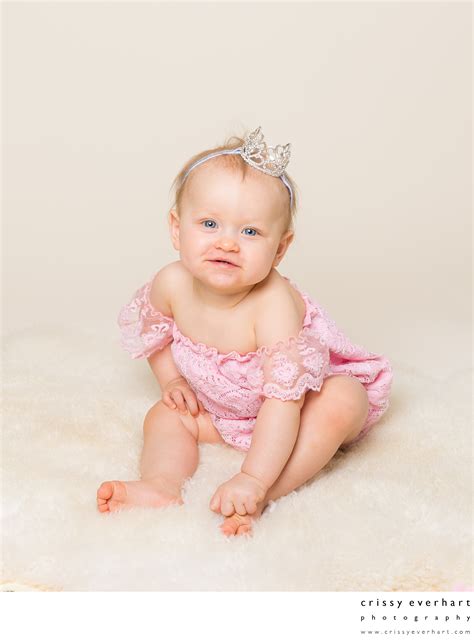 One Year Old Girl With Crown On Ivory Background