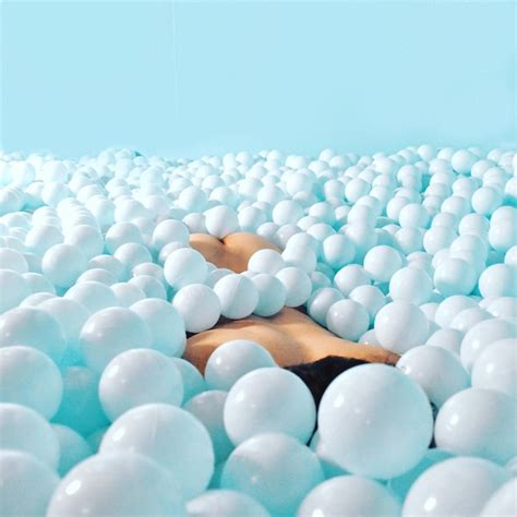 Premium Photo Close Up Of Naked Person Lying Down In Ball Of Pool
