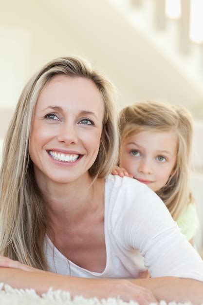 Premium Photo Smiling Mother And Daughter On The Floor