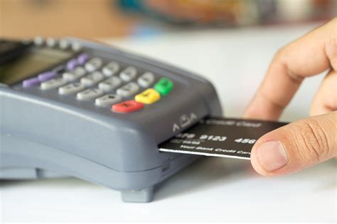 Hand Push Credit Card Into A Credit Card Machine Selective Foc