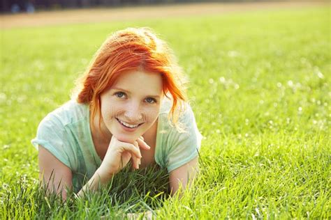 Relaxing Redhead Girl Lying On Grass Woman Relaxation Outdoor Stock