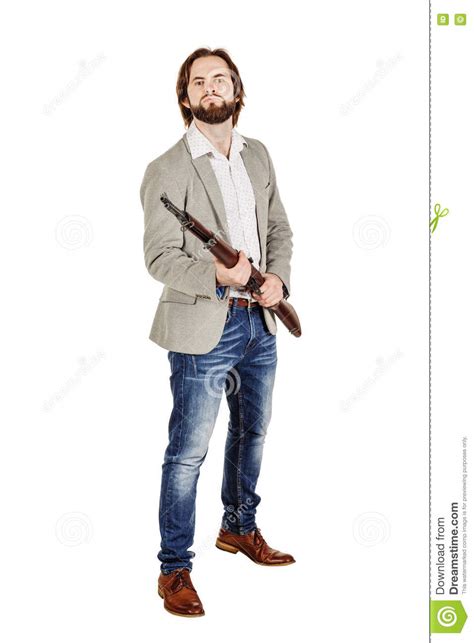 Man Holding A Machine Gun Isolated On White Background Stock Photo