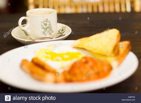 American Or Western Breakfast Sausages Fried Egg Beans Toasts And