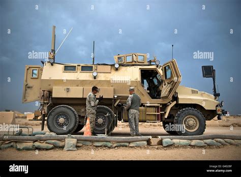 Us Army Sergeant Refuels A Caiman Mrap Vehicle Iraq Stock Photo Alamy