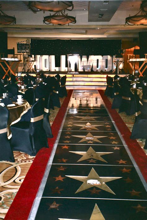 Led orchid centerpiece with light blue chips & floating candles led orchid centerpiece. Hollywood Themed Staging | Hollywood theme prom, Hollywood ...
