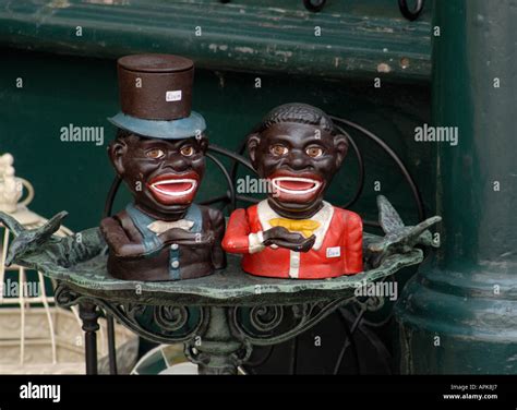 Cast Iron Money Boxes In The Form Of Caricature Smiling Negro Men Stock